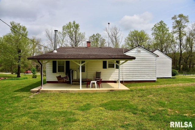 22 Roundhouse Rd, Herod, IL 62947 - rear view of property featuring a lawn, a patio, and a chimney