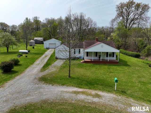 22 Roundhouse Rd, Herod, IL 62947 - bungalow-style home featuring a porch, driveway, a garage, an outdoor structure, and a front lawn