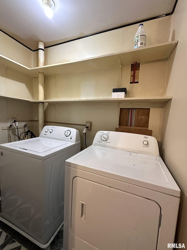 washroom featuring independent washer and dryer and laundry area