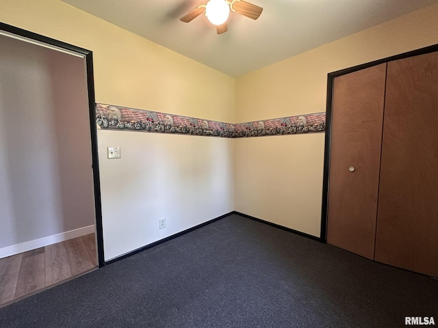 unfurnished bedroom featuring a ceiling fan, baseboards, and dark wood finished floors