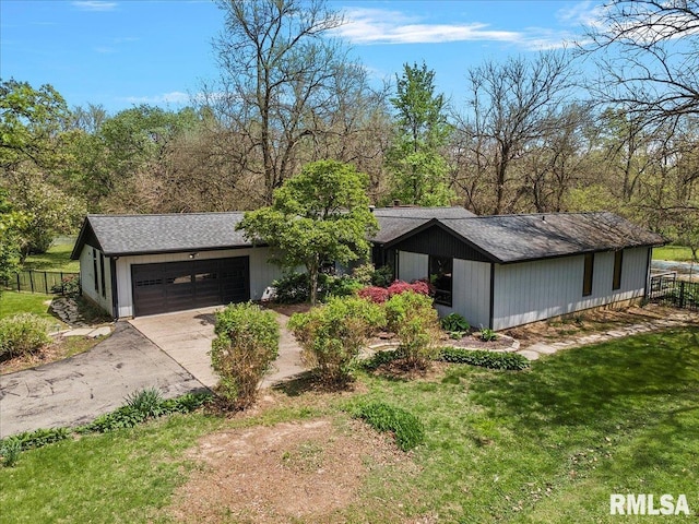454 Brian Ln, Dawson, IL 62520 - view of front facade with concrete driveway, fence, a front lawn, and a garage