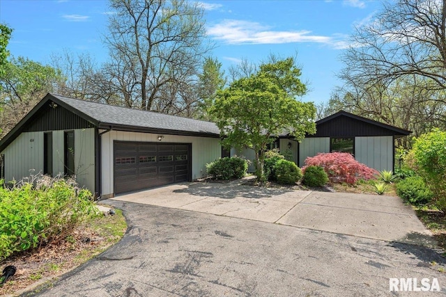 454 Brian Ln, Dawson, IL 62520 - ranch-style house with an attached garage, roof with shingles, and driveway