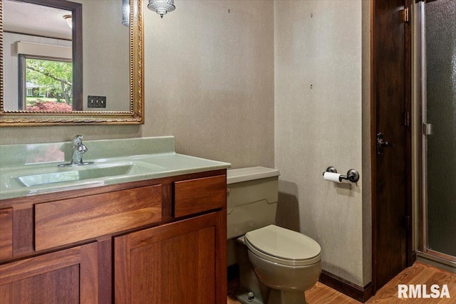 454 Brian Ln, Dawson, IL 62520 - bathroom with toilet, wood finished floors, and vanity