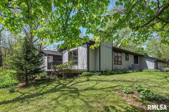 454 Brian Ln, Dawson, IL 62520 - view of property exterior with a lawn and central AC
