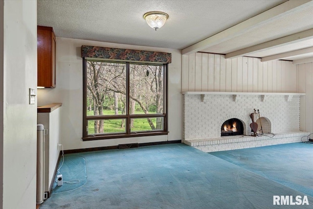 454 Brian Ln, Dawson, IL 62520 - unfurnished living room with carpet floors, baseboards, a textured ceiling, and visible vents