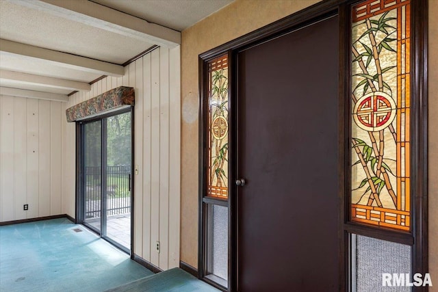 454 Brian Ln, Dawson, IL 62520 - entryway with carpet floors, wooden walls, beamed ceiling, and baseboards