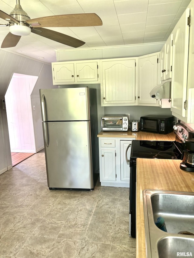 286 Kochs Ln, Meredosia, IL 62665 - kitchen featuring freestanding refrigerator, black microwave, under cabinet range hood, range with electric stovetop, and a ceiling fan