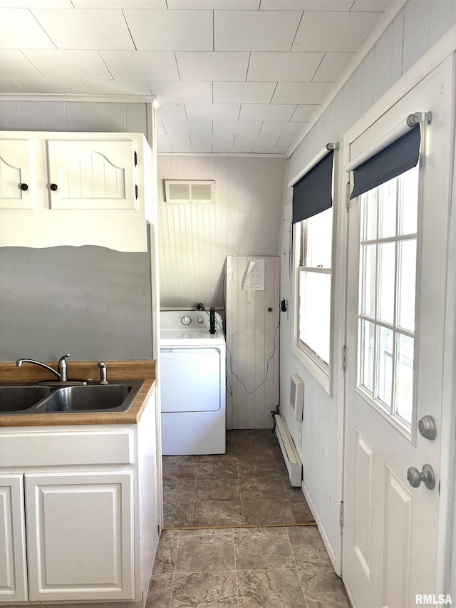 286 Kochs Ln, Meredosia, IL 62665 - laundry room with washer / dryer, baseboard heating, stone finish flooring, and wooden walls