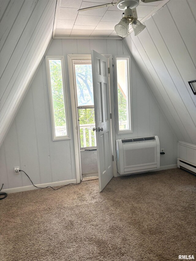 286 Kochs Ln, Meredosia, IL 62665 - additional living space with vaulted ceiling, carpet flooring, a wall mounted air conditioner, and ceiling fan