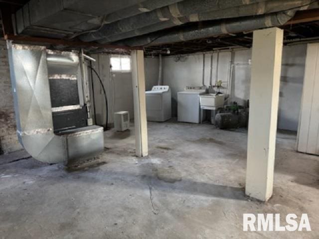 603 E Old 36th Hwy, Alexander, IL 62601 - basement with heating unit, a sink, and washing machine and clothes dryer