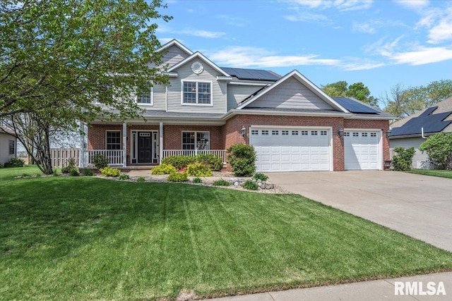 craftsman-style home featuring an attached garage, a front lawn, brick siding, covered porch, and driveway