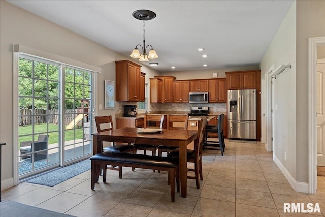 dining space with light tile patterned flooring, baseboards, a chandelier, and recessed lighting