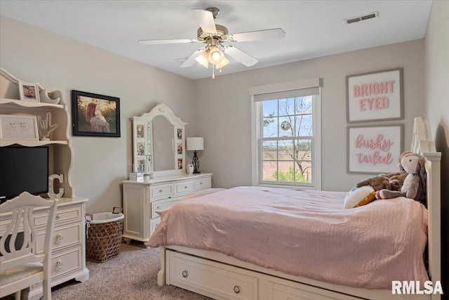 bedroom with light carpet, a ceiling fan, and visible vents
