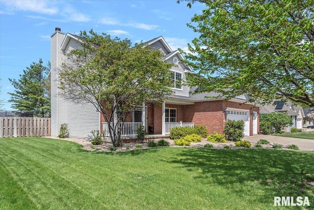 view of front of property with a porch, fence, a front lawn, concrete driveway, and an attached garage
