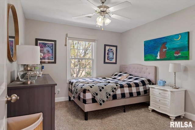 bedroom featuring baseboards, ceiling fan, and light colored carpet