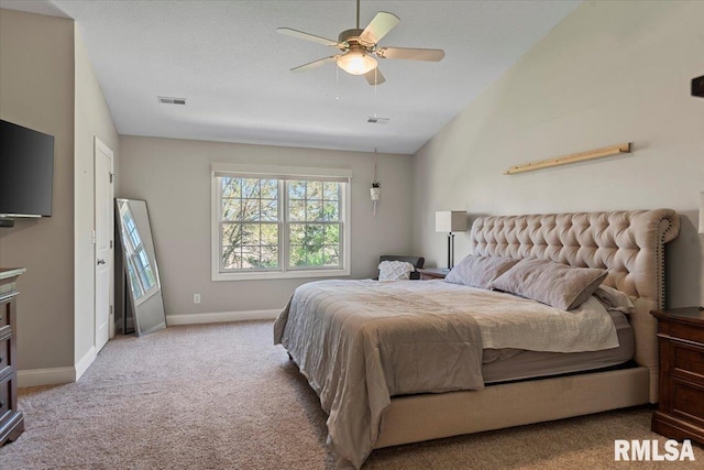 carpeted bedroom featuring a ceiling fan, baseboards, visible vents, and vaulted ceiling
