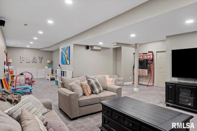 living area featuring recessed lighting and light colored carpet