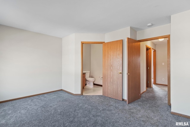 unfurnished bedroom featuring baseboards, carpet, and connected bathroom