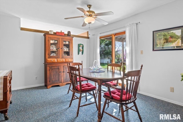 dining room featuring baseboards, carpet, and a ceiling fan