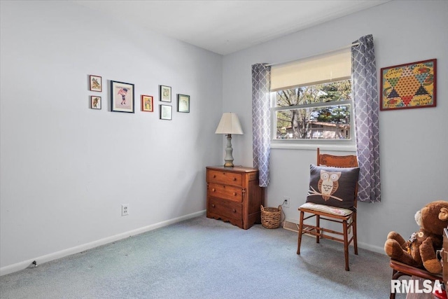 sitting room with baseboards and carpet flooring