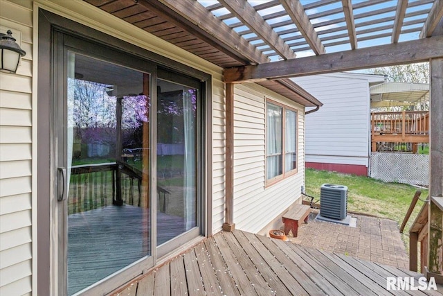 wooden terrace featuring a pergola and central AC