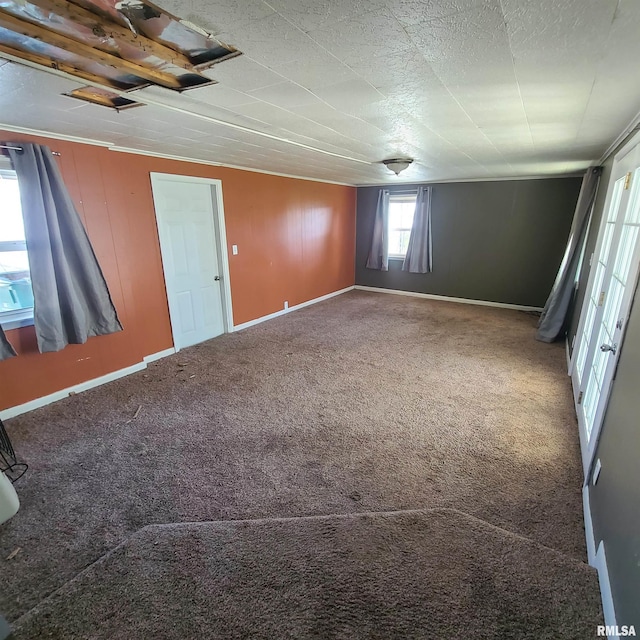 spare room with carpet flooring and baseboards