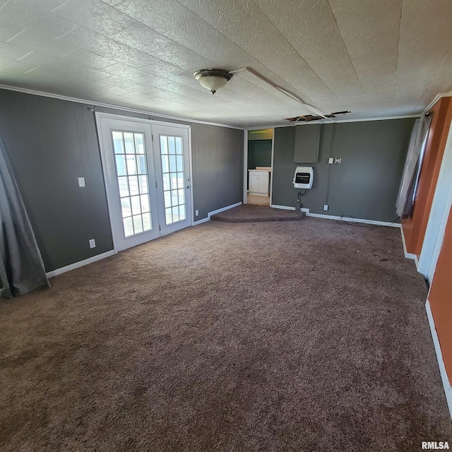 carpeted empty room with baseboards and crown molding
