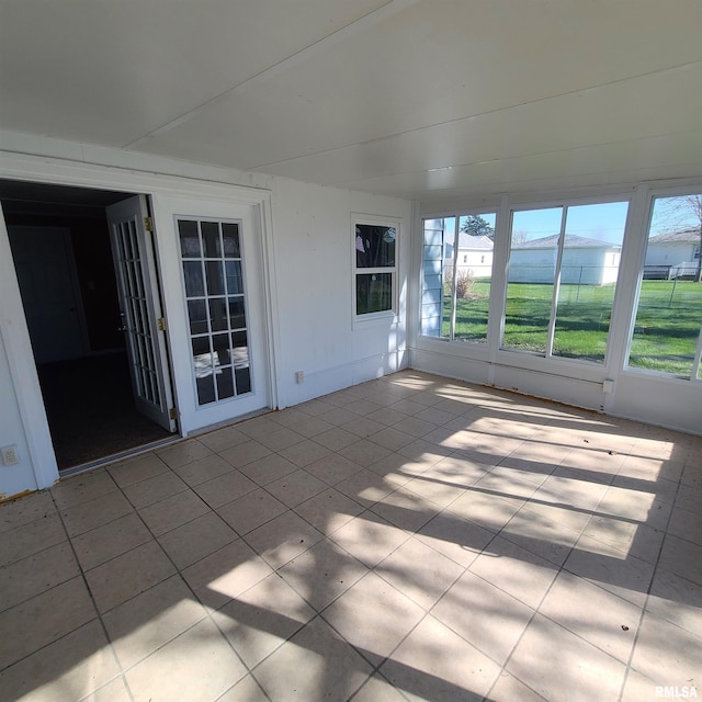 unfurnished sunroom with a wealth of natural light