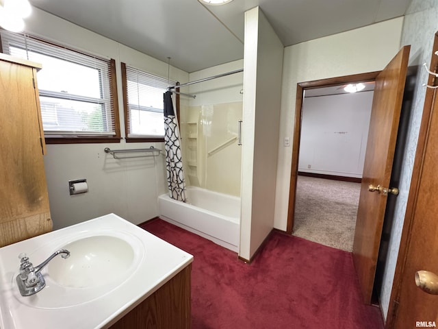 bathroom featuring shower / bathtub combination with curtain and vanity