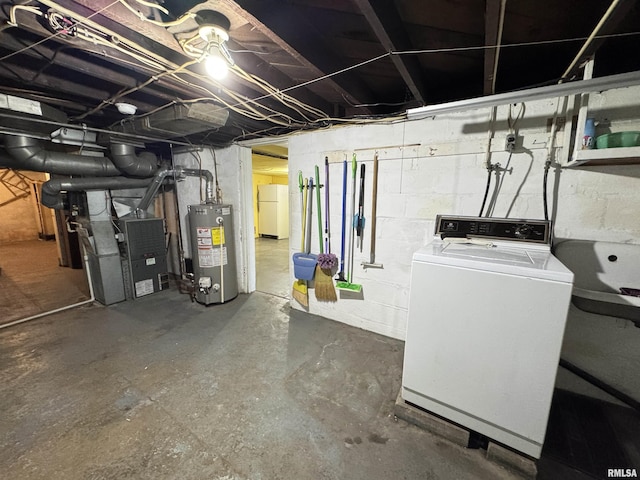 unfinished basement featuring freestanding refrigerator, heating unit, washer / clothes dryer, and gas water heater