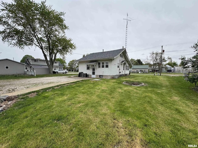 exterior space featuring driveway and a front yard