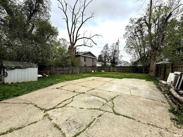 view of patio with a storage shed, an outdoor structure, and a fenced backyard