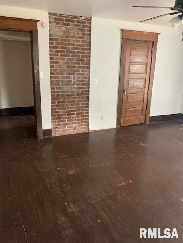 400-402 E Laurel, Springfield, IL 62704 - spare room with hardwood / wood-style floors, ceiling fan, and baseboards