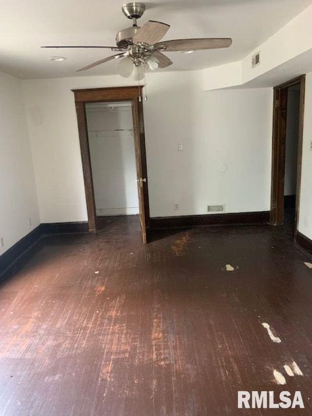 400-402 E Laurel, Springfield, IL 62704 - empty room with wood-type flooring, ceiling fan, and baseboards