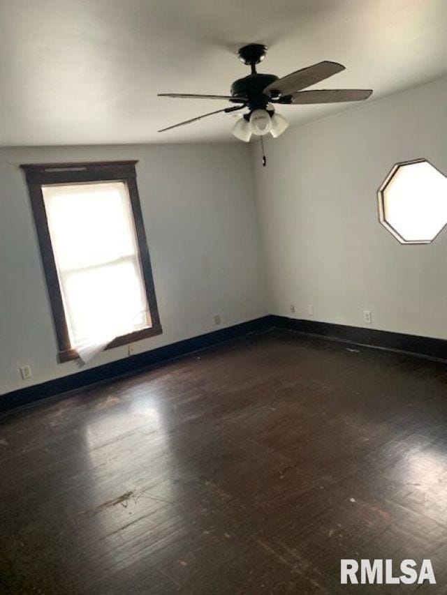 400-402 E Laurel, Springfield, IL 62704 - empty room featuring ceiling fan, baseboards, and wood-type flooring