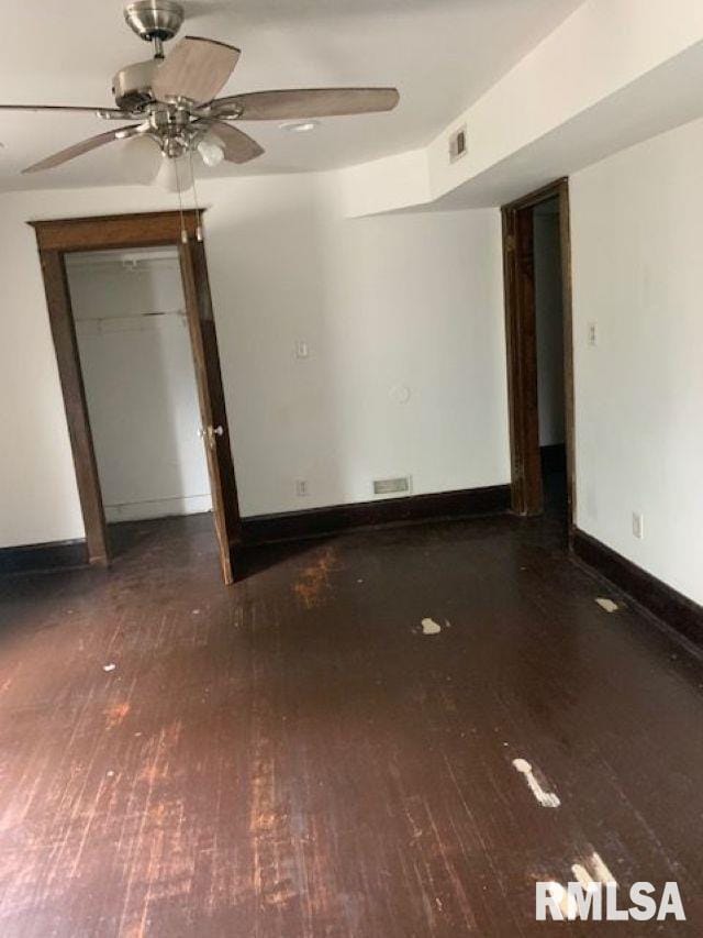 400-402 E Laurel, Springfield, IL 62704 - unfurnished bedroom with hardwood / wood-style floors, baseboards, a closet, and ceiling fan