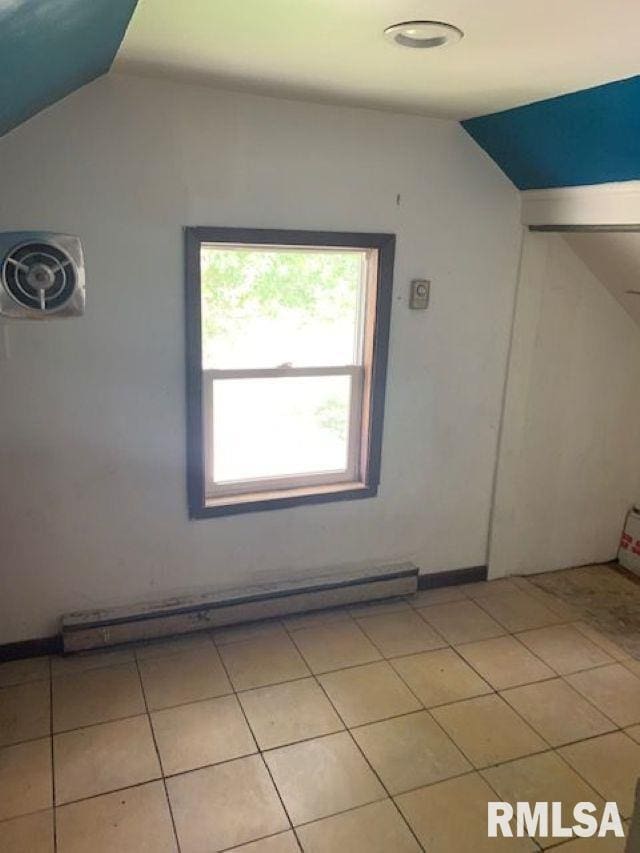 400-402 E Laurel, Springfield, IL 62704 - additional living space featuring lofted ceiling, baseboard heating, and light tile patterned flooring
