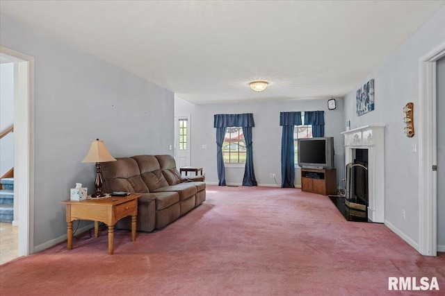 3300 Winch Rd, Springfield, IL 62707 - carpeted living room featuring a fireplace, baseboards, and stairs