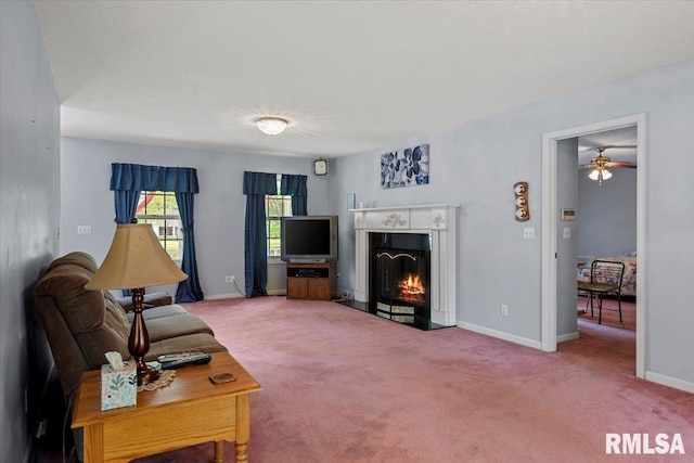 3300 Winch Rd, Springfield, IL 62707 - carpeted living area featuring baseboards, a lit fireplace, and ceiling fan
