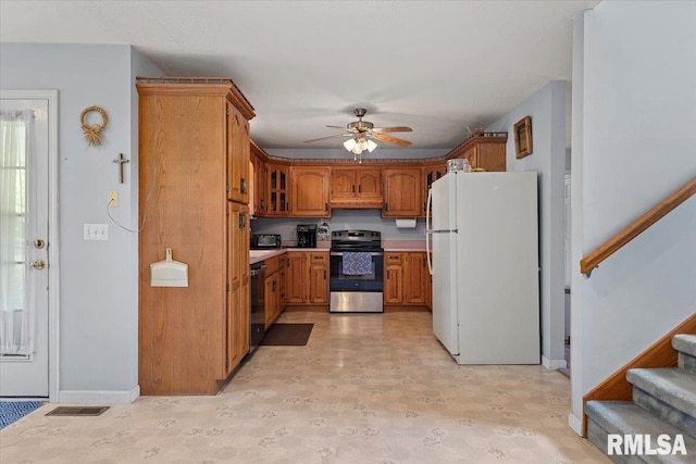 3300 Winch Rd, Springfield, IL 62707 - kitchen featuring electric stove, freestanding refrigerator, brown cabinets, ceiling fan, and baseboards