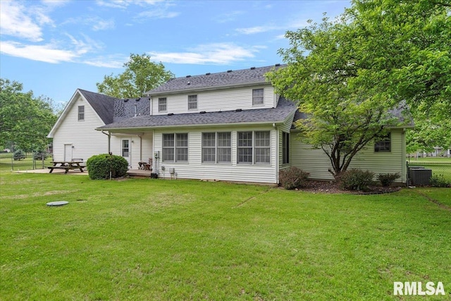 3300 Winch Rd, Springfield, IL 62707 - rear view of property with central AC unit, a shingled roof, and a patio