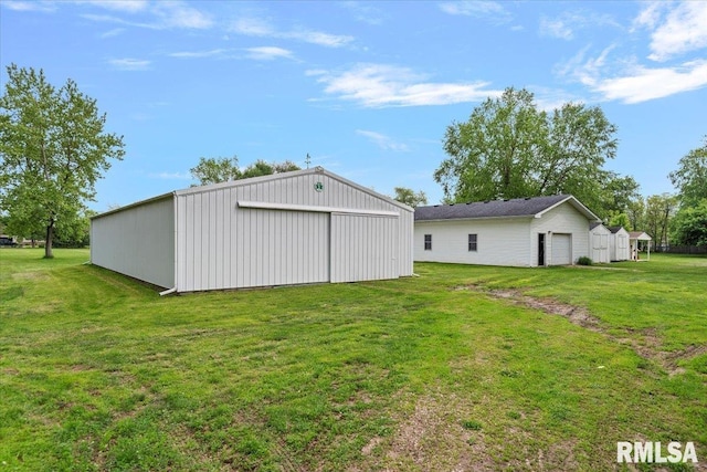 3300 Winch Rd, Springfield, IL 62707 - view of green lawn with a pole building, an outbuilding, and a garage