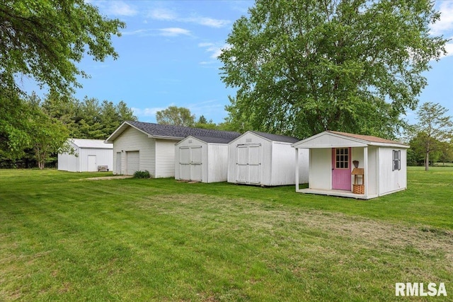 3300 Winch Rd, Springfield, IL 62707 - view of grassy yard with a garage