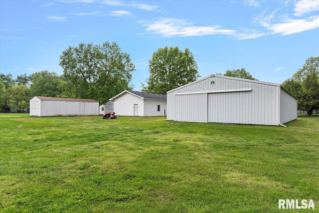 3300 Winch Rd, Springfield, IL 62707 - view of grassy yard with a pole building, an outdoor structure, and a garage
