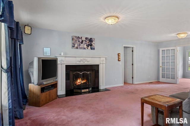 3300 Winch Rd, Springfield, IL 62707 - carpeted living room featuring a lit fireplace and baseboards