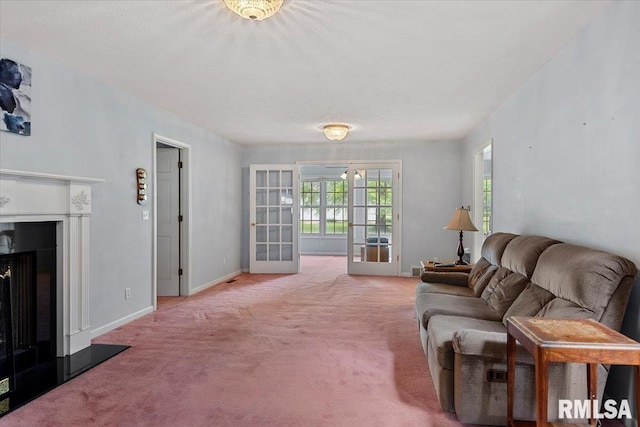 3300 Winch Rd, Springfield, IL 62707 - living area with french doors, carpet, a fireplace with raised hearth, and baseboards