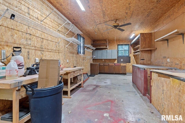 interior space with ceiling fan