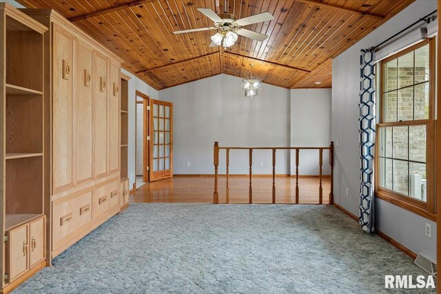 carpeted empty room with wood ceiling, baseboards, ceiling fan with notable chandelier, and lofted ceiling