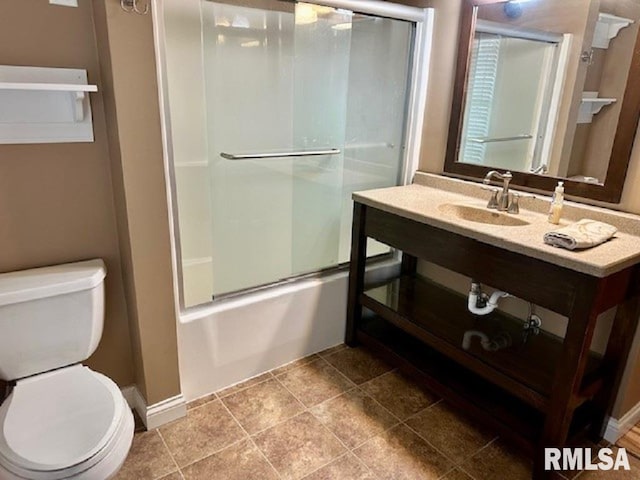 full bath featuring vanity, enclosed tub / shower combo, and toilet