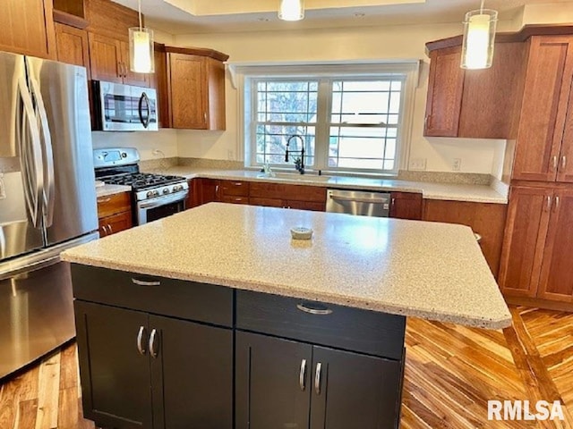 kitchen with a sink, stainless steel appliances, and brown cabinets